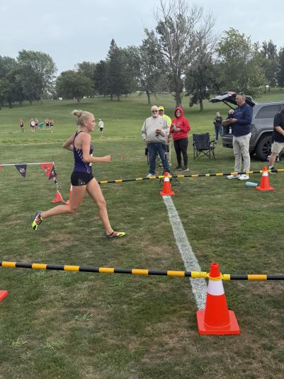 A side view of Iris Melody crossing the finish line.