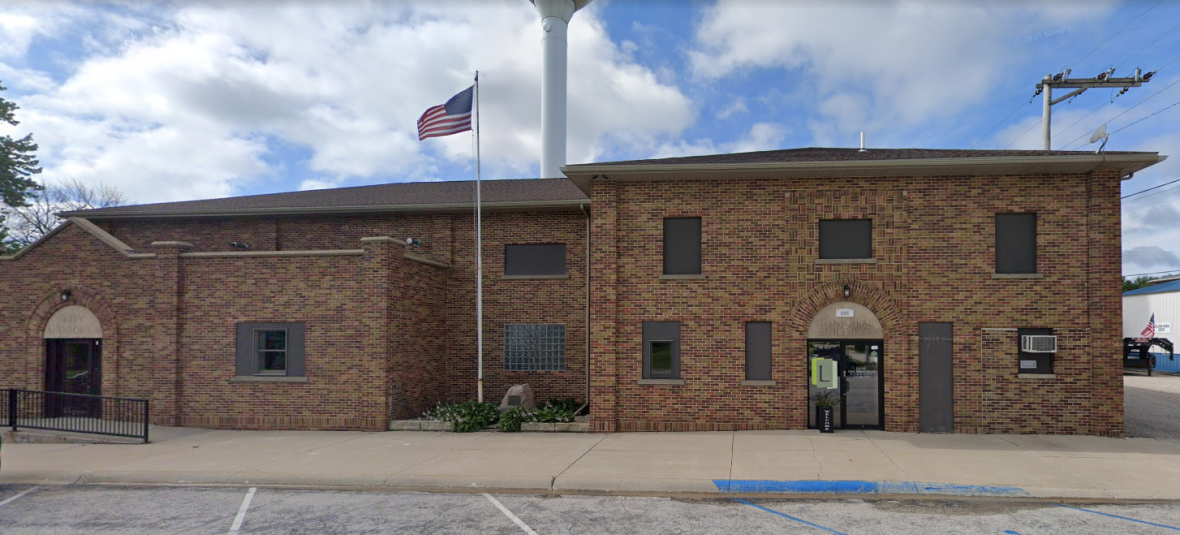 The exterior of the Lohrville, Iowa municipal building, a two-story, brown brick building.