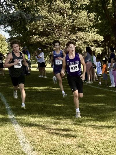 Several runners run along the course.
